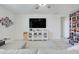 Bright and airy living room featuring modern furniture and clean, white walls at 1127 Foreshore Ln, Haines City, FL 33844