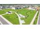 Aerial view of a modern park with walking paths, landscaping and dog park at 1127 Foreshore Ln, Haines City, FL 33844