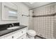 Bathroom features updated fixtures, including a black countertop vanity and a tiled walk-in shower at 11811 Scarecrow Ln, Orlando, FL 32821