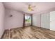 Spacious bedroom with natural light and ceiling fan, with ample closet space, for comfortable living at 11811 Scarecrow Ln, Orlando, FL 32821