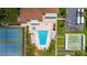 Aerial view of community pool, tennis courts, and bocce ball at 11811 Scarecrow Ln, Orlando, FL 32821