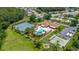 Bird's-eye view of the community center, showcasing amenities, including tennis courts and a pool at 11811 Scarecrow Ln, Orlando, FL 32821
