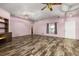 Open living room with wood laminate flooring and natural light at 11811 Scarecrow Ln, Orlando, FL 32821