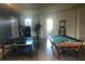 Fun game room with ping pong table, pool table and natural light at 120 Terrace Ridge Cir # 120, Davenport, FL 33896