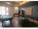 Game room with pool table, foosball, ping pong and seating at 120 Terrace Ridge Cir # 120, Davenport, FL 33896