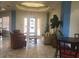 Inviting lobby with comfortable seating, tile floors, and natural light at 120 Terrace Ridge Cir # 120, Davenport, FL 33896