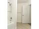 Modern bathroom featuring a sleek tub with a shower head and subway tile at 1204 Duncan Ct, Longwood, FL 32779