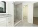 A modern bathroom with a vanity, walk-in shower, and tile flooring at 1204 Duncan Ct, Longwood, FL 32779
