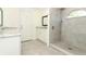 Modern bathroom featuring double vanity with granite countertops and walk-in shower with rain shower head at 1204 Duncan Ct, Longwood, FL 32779