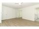 Spacious bedroom with light wood floors, a ceiling fan, and doorway view to the bath and an adjacent room at 1204 Duncan Ct, Longwood, FL 32779