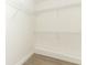 An empty walk-in closet with white wire shelving and light wood flooring at 1204 Duncan Ct, Longwood, FL 32779
