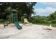 Park playground with a green slide, climbing structure, and a toy airplane at 1204 Duncan Ct, Longwood, FL 32779