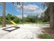 Community playground with a yellow slide, swings, and a sandbox area for children at 1204 Duncan Ct, Longwood, FL 32779