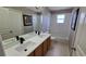 Standard bathroom design featuring a dual sink vanity and shower-tub combo at 12126 Diedra Ct, Orlando, FL 32825