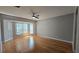 Cozy bedroom with neutral paint, plush flooring, and a large window to let natural light in at 12126 Diedra Ct, Orlando, FL 32825
