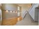 Bright living room featuring hardwood floors, a staircase, and an abundance of natural light at 12126 Diedra Ct, Orlando, FL 32825