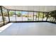 Screened-in patio with concrete flooring, offering an outdoor living space with backyard view at 12126 Diedra Ct, Orlando, FL 32825