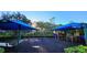 Community playground with a shaded play structure, swing set and mulch ground cover at 12126 Diedra Ct, Orlando, FL 32825