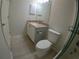 Bathroom featuring modern vanity, granite countertop, and a toilet with a tiled floor at 1221 Santa Cruz Dr, The Villages, FL 32162