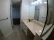 Bathroom featuring a vanity with storage and large mirror at 1221 Santa Cruz Dr, The Villages, FL 32162