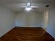 Bedroom with hardwood floors and accent wall at 1221 Santa Cruz Dr, The Villages, FL 32162
