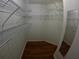 Walk-in closet with built-in shelving for ample storage at 1221 Santa Cruz Dr, The Villages, FL 32162