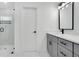 Elegant bathroom with a glass-enclosed shower, modern vanity, and stylish fixtures at 13525 Se 100Th Ave, Belleview, FL 34420