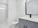 Bathroom features a modern vanity with sleek fixtures, complementing the clean aesthetic at 13525 Se 100Th Ave, Belleview, FL 34420