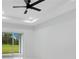 Bright bedroom with sliding glass doors and views of the backyard at 13525 Se 100Th Ave, Belleview, FL 34420