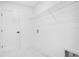 A tidy laundry room features a wire rack and a door with a black handle at 13525 Se 100Th Ave, Belleview, FL 34420