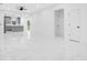 An expansive living room with access to a modern kitchen with bar seating at 13525 Se 100Th Ave, Belleview, FL 34420