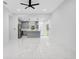 Bright living space with an open floor plan, modern kitchen, and sleek marble tile floors at 13525 Se 100Th Ave, Belleview, FL 34420