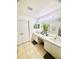 Bright bathroom featuring double sinks, a soaking tub, and ample counter space at 14033 Turning Leaf Dr, Orlando, FL 32828