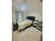 Cozy bedroom with dark wood floors, and a comfortable bed with decorative pillows and a white rug at 14033 Turning Leaf Dr, Orlando, FL 32828