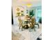 Elegant dining area showcasing a circular glass-top table and six decorative chairs with ample space for entertaining at 14033 Turning Leaf Dr, Orlando, FL 32828