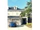 Two-story home boasting attached garage, well-manicured landscaping, and neutral color scheme in desirable community at 14033 Turning Leaf Dr, Orlando, FL 32828