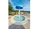 Relaxing hot tub area featuring a unique mushroom water feature for a spa-like experience at 14033 Turning Leaf Dr, Orlando, FL 32828