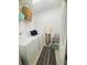 Laundry room with washer, dryer, storage shelves and ironing board at 14033 Turning Leaf Dr, Orlando, FL 32828