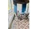 Cozy screened patio features outdoor seating with a brown table, umbrella, and patterned brown rug at 14033 Turning Leaf Dr, Orlando, FL 32828
