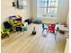 Community playroom with colorful furnishings, a TV, and plenty of space for children to play at 14033 Turning Leaf Dr, Orlando, FL 32828