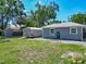 Spacious backyard showcasing a shed and lush green lawn, creating an inviting outdoor space at 141 S Central Ave, Apopka, FL 32703