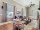 Bright living room featuring hardwood floors, neutral color, and a cozy fireplace at 141 S Central Ave, Apopka, FL 32703