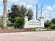 Community entrance sign reading 'The Enclaves Amenity Center' with landscaping at 1429 Discovery St, Davenport, FL 33896