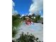 A playful splash pad area with a pirate ship slide, surrounded by lush tropical greenery, promises endless fun at 1429 Discovery St, Davenport, FL 33896