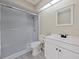 Neutral-colored bathroom featuring a vanity, toilet, and glass-enclosed shower at 208 Frinton Cv, Longwood, FL 32779
