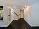 View of the home's entry foyer featuring fresh paint, hardwood floors, recessed lighting, and staircase to the upper level at 208 Frinton Cv, Longwood, FL 32779