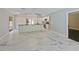 Updated kitchen features stainless steel appliances, modern countertops, custom cabinets, and marble tile flooring at 208 Frinton Cv, Longwood, FL 32779