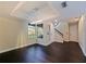 Bright living room with black hardwood floors, recessed lighting, and neutral paint colors that fill the space at 208 Frinton Cv, Longwood, FL 32779