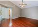 A spacious main bedroom with vaulted ceiling and hardwood floors and walk-in closet at 208 Frinton Cv, Longwood, FL 32779