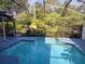 Enjoy a refreshing dip in this screened-in pool, perfect for hot days and outdoor fun at 208 Frinton Cv, Longwood, FL 32779